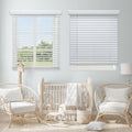 2" Cordless Faux Wood Blinds in a nursery, styled above crib and rattan chairs