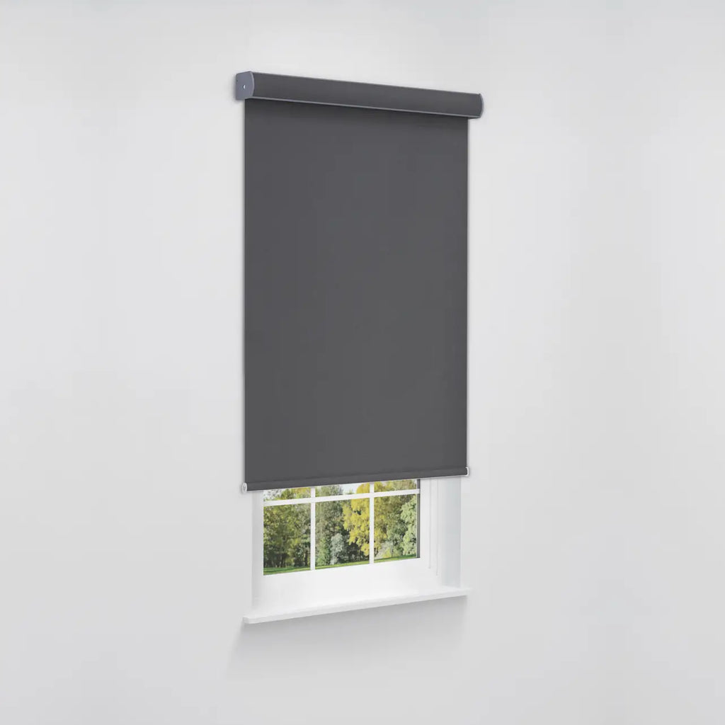 Angled product view of a dark gray roller shade fully extended, showing headrail and bottom bar detail