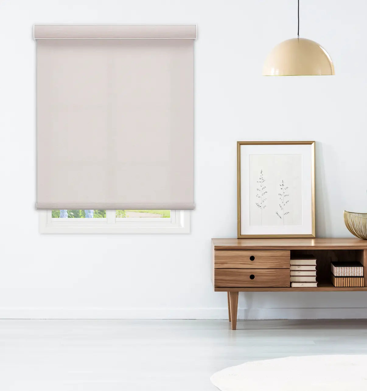 Coastal Blackout Roller Shade in Sandbar Cream installed above a living room console table