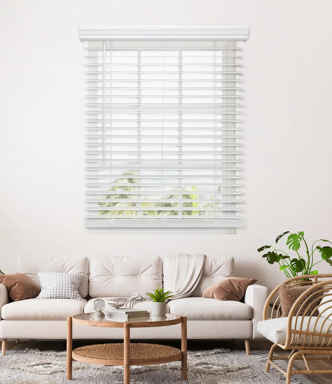 2" Cordless Faux Wood Blinds in a dining room, one raised and one lowered, over tropical view
