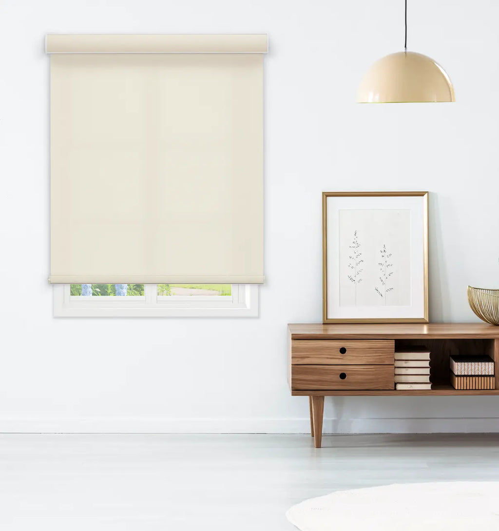  straight-on)Coastal Light Filtering Roller Shade in Sandbar Cream installed above a living room console table