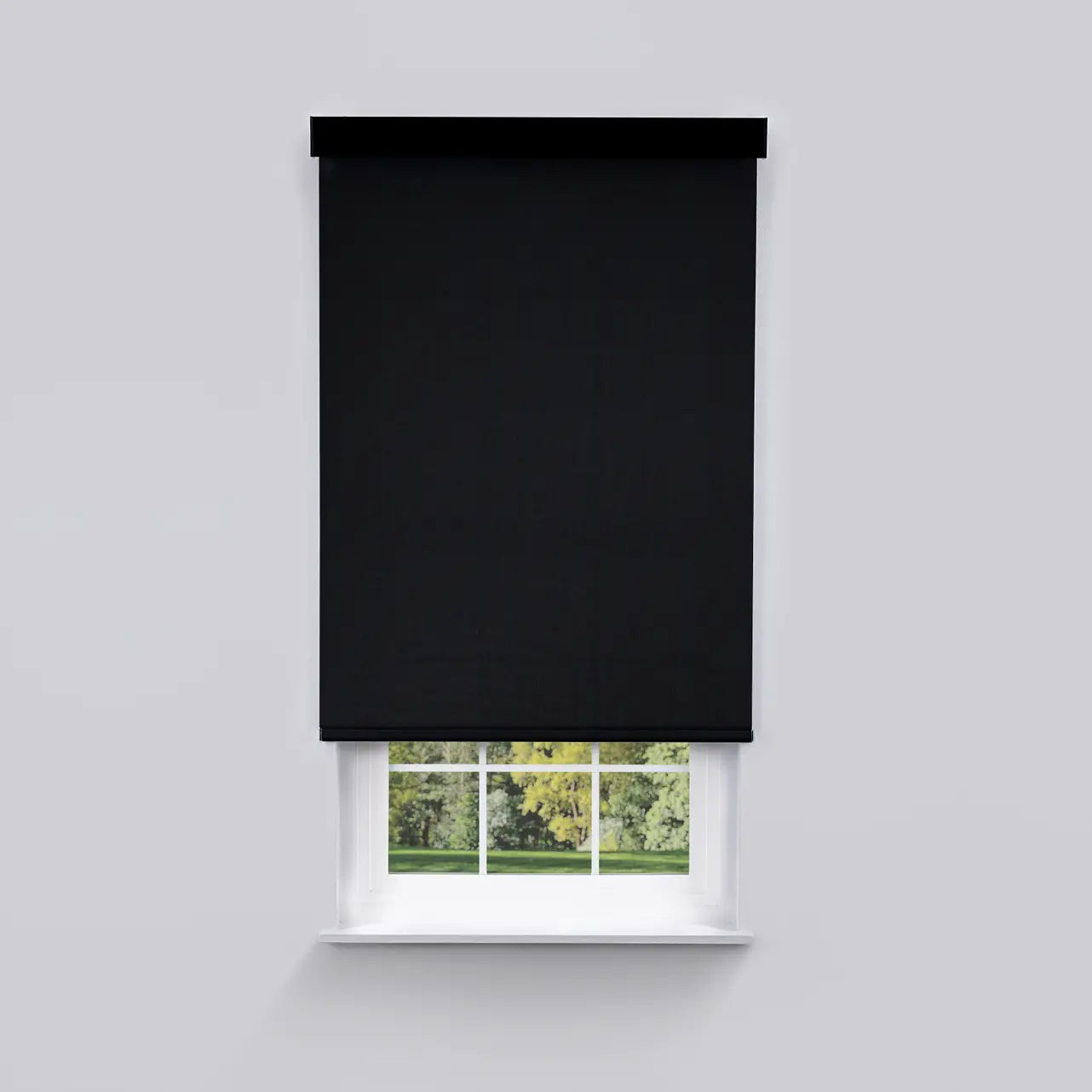 1% Solar Screen Roller Shade in black, front view on window with cassette headrail
