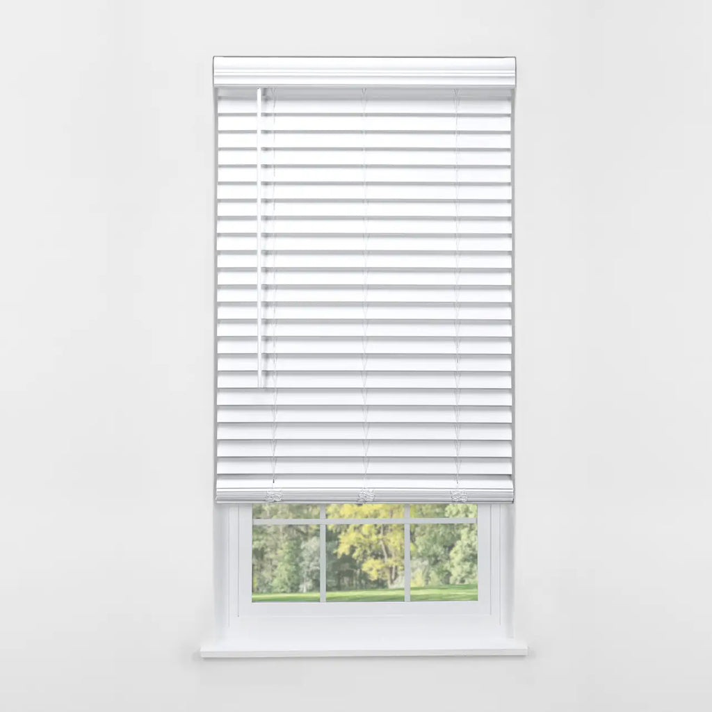 White 2" Cordless Faux Wood Blind, front view on window with green lawn visible