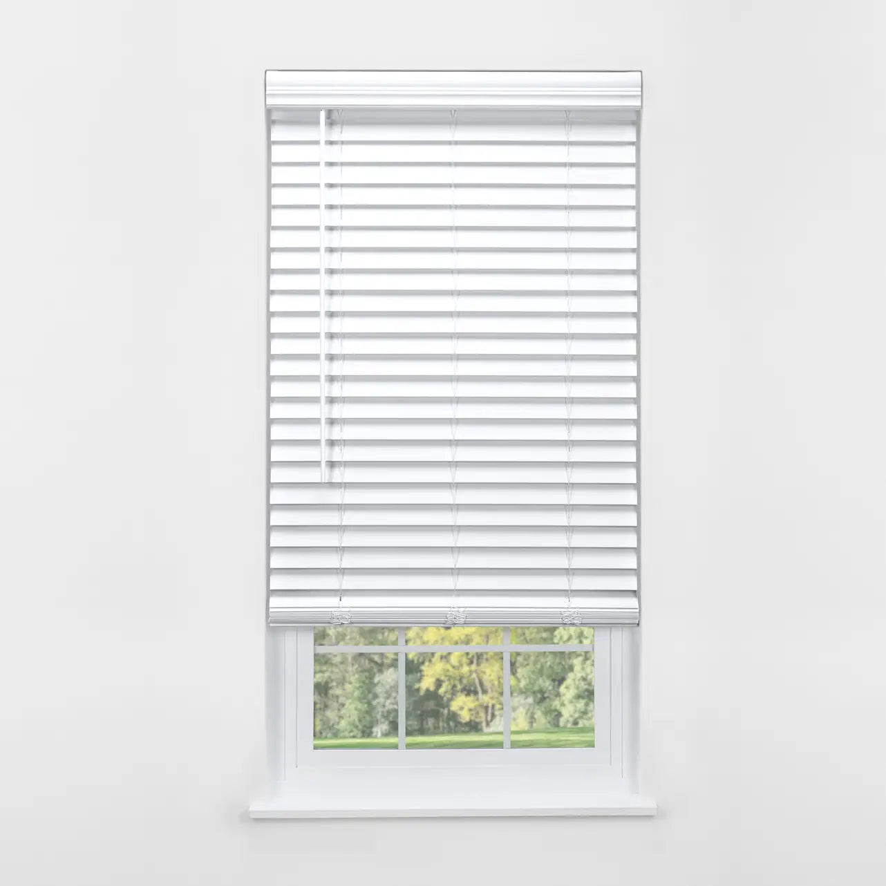 White 2" Cordless Faux Wood Blind, front view on window with green lawn visible